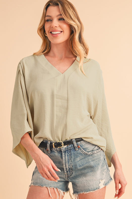 Parchment Solid Color Crinkled V Neck Ruffled Sleeve Blouse