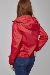 Women's red full zip packable rain jacket and windbreaker