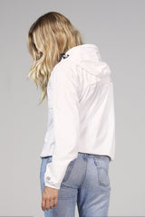 White quarter zip packable rain jacket and windbreaker