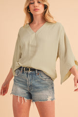 Parchment Solid Color Crinkled V Neck Ruffled Sleeve Blouse