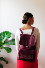 MAGENTA LEATHER BACKPACK WITH WOVEN ACCENT ON FRONT POCKET