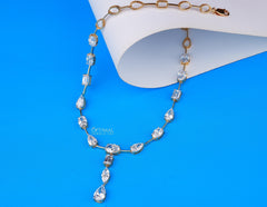 Exquisite Gold Necklace Adorned with Pear, Oval, and Rectangular Cut